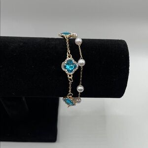 Elegant Gold and Blue Bracelet with Pearls